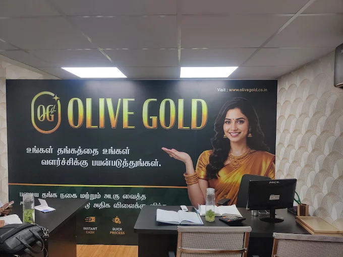 Interior of Olive Gold Pondy Bazaar valuation studio with brand showcase wall and consultation desk